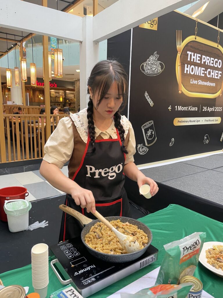 Jeanette in the final stages of preparing her cream-based pasta during the last round of the competition.